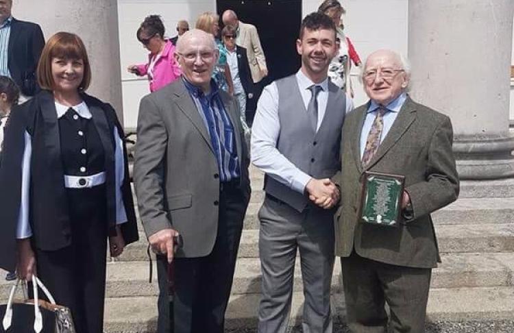 Gary Farrell is pictured with his parents Mary and Peadar as he shakes  hands with President Michael D. Higgins