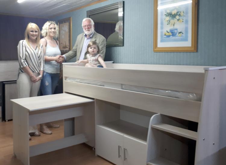 Oisin O'Sullivan (R) and Alison Casey (L) from the Offaly Express present Valerie White with her prize after the Offaly Express competition