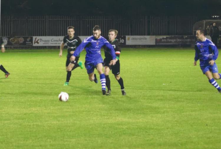 Macdarragh O'Neill on the attack with Brian Francis in support.