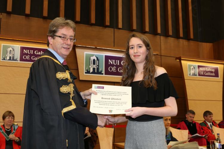 Pictured receiving an Excellence Scholarship scroll and a cheque for &euro;1,500 from NUI Galway President, Dr Jim Browne, is Hannah Plunkett from Banagher
