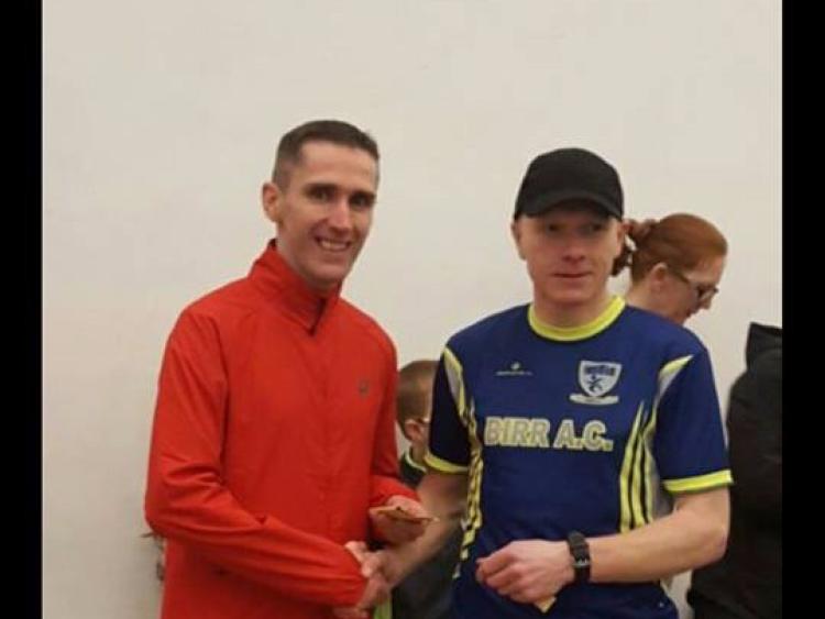 Dave Murray being presented with his prize by Andy Masterson of Birr AC after winning the Sean Lowry Memorial 5k