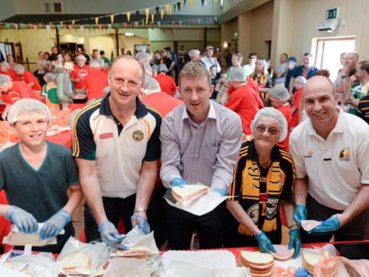 9 June 2013; Taking part in the Carrolls ham sandwich world record attempt  in aid of Irish Autism Action are, from left, Brian Duignan, age 12, from Durrow, Co. Offaly, Offaly's Joe Dooely, Offaly's Brian Whelehan, Ann Purcell, from Mooncoin, Co. Kilkenny, and Kilkenny's DJ Carey. A new record of 3,140 sandwiches in 37 minutes was set. Leinster GAA Hurling Senior Championship Quarter-Final, Offaly v Kilkenny, O'Connor Park, Tullamore, Co. Offaly. Picture credit: Brian Lawless / SPORTSFILE