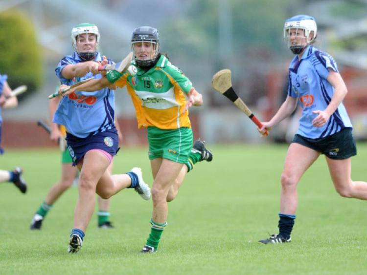 ***No repro fee** 22 June 2013: Tina Hannon, Offaly, in action against Grainne Quinn, left and Eimear McCarthy, Dublin. Liberty Insurance Senior Camogie Championship Group 1. Dublin v Offaly,  OToole Park, Crumlin, Dublin. Picture credit: CQPhotography