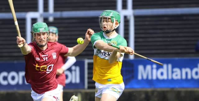 Fiachra Carroll (Offaly) clears ahead of Eoghan Beehan (Westmeath). Picture: Aoife Maher
