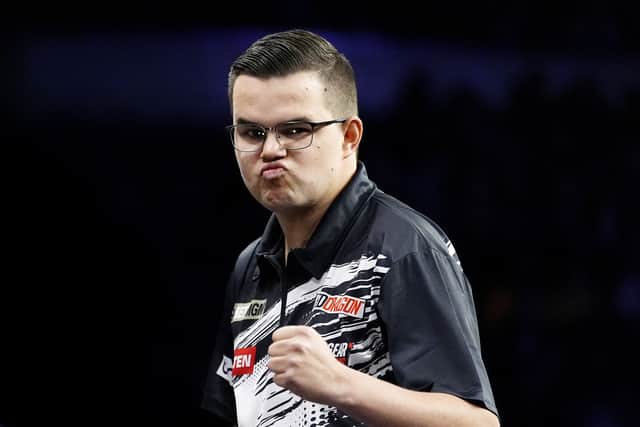 But Littler, who is a big Manchester United fan and hails from nearby Warrington, failed to hit top form and lost a deciding leg in a tense 6-5 defeat against Dutchman Van Veen.