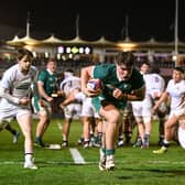 Lee Fitzpatrick charging over against England.