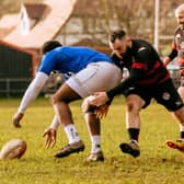 Niall McCabe making a tackle on Saturday, with Mark McGrath in support.