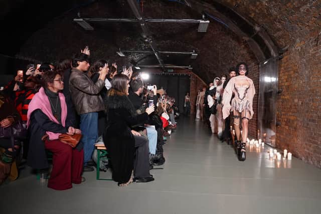 Dreaming Eli’s pieces are made entirely in London, with many incorporating lace-up adjustability designed to accommodate different body shapes and extend a garment’s lifespan. That emphasis on longevity and thoughtful construction aligns with Trombatore’s broader philosophy of clothing as an evolving companion rather than disposable spectacle.