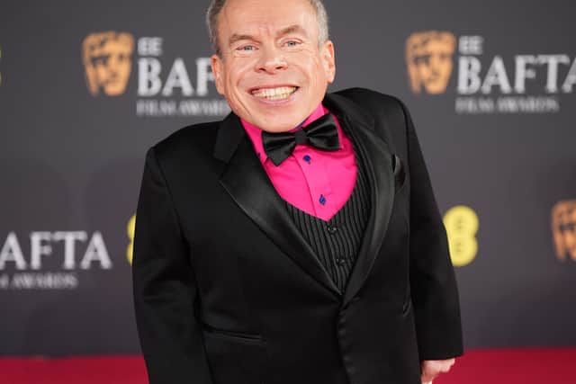 Meanwhile, Davis wore an eye-catching hot pink shirt under his black tuxedo, standing out among the stars on the red carpet.