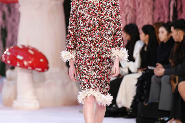 The traditional, perhaps stuffy, fitted tweed jackets were reworked into oversized shackets, while the classic Chanel court shoe was updated into a slingback, making it feel cooler and more contemporary.