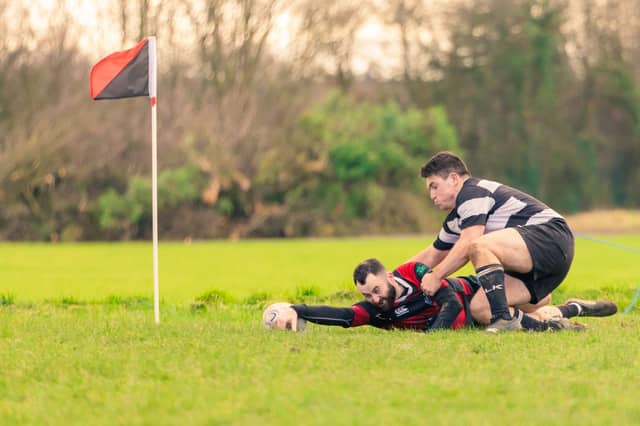 Niall McCabe dots down just short of the line, vs Seapoint on Saturday afternoon.