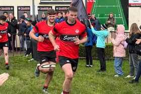 Karl Dunne and Kalvin Mahon run out to a guard of honour from the Tullamore Minis on Saturday.