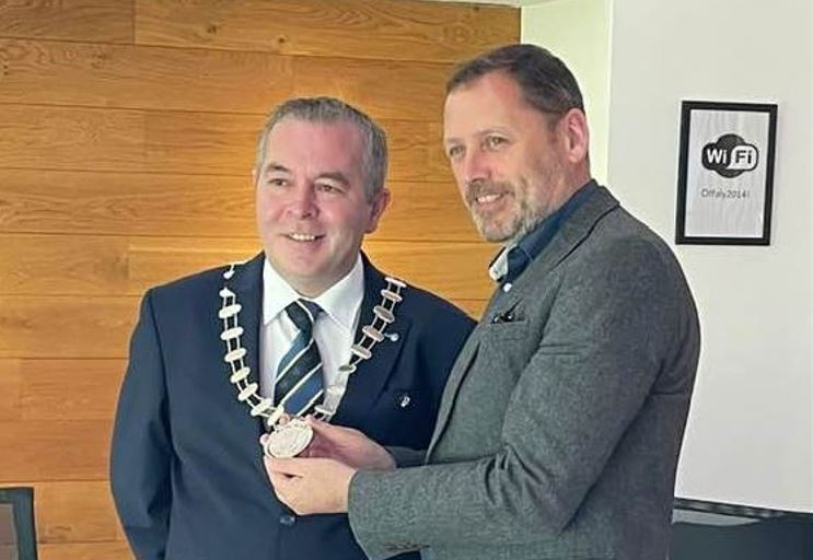 Cllr Frank Moran pictured wearing the Council Cathaoirleach chain of office, with fellow Clara man and Fianna Fail representative, Barry  Cowen TD