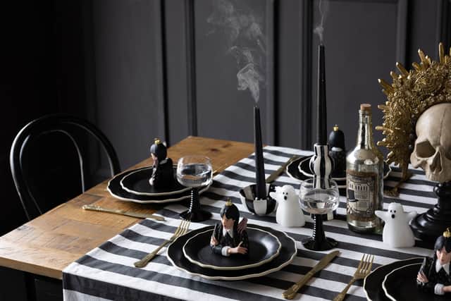 7. 70s French Style Wine Glasses In Black, £14 each; Wednesday-Inspired Decorations, £25 each; 12-Piece Black & Off-White Edge Bon Apetit Dinner Set, £120, Rockett St George