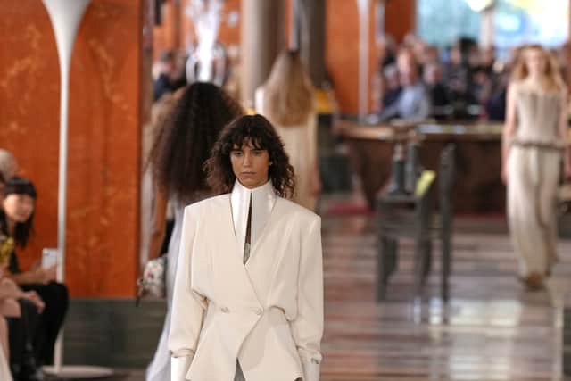 A return of cigarette trousers and culottes pushed the tailored agenda, while shorts in knit fabric stretched the rules of knitwear beyond jumpers. Slimline flats, in styles akin to brogues and Clarks Wallabees, echoed the wider turn toward relaxed runway dressing.