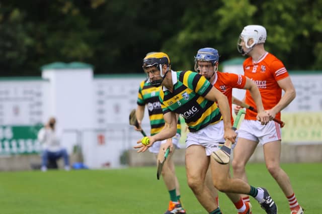 Belmont's Colin Egan collects the ball in front of Shinrone's Adam Landy.