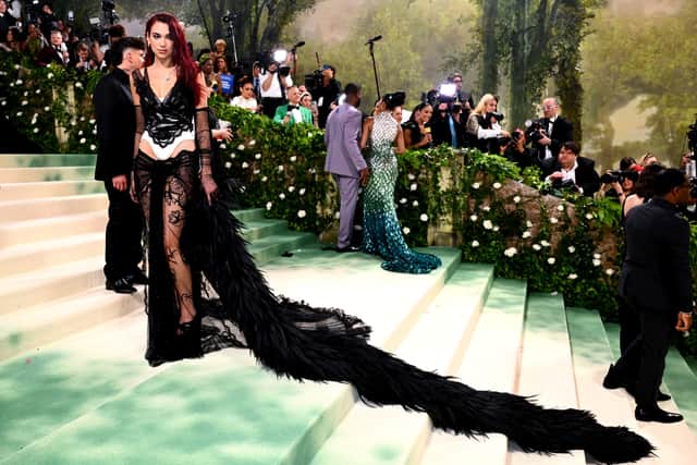 Lipa leveraged pared-back looks for beauty campaigns and red carpet appearances – sporting a dark palette, slicked-back hair and flawless skin – while still referencing her bold performance persona in daring silhouettes.
