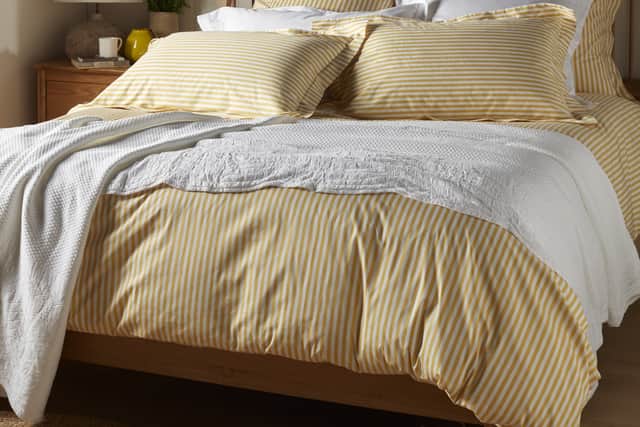 5. Yellow Betsy Stripe 100% Organic Cotton Bed Linen, Double from £62.30 (was £89); Pillowcase, Standard, £11.90, (was £17), Secret Linen Store