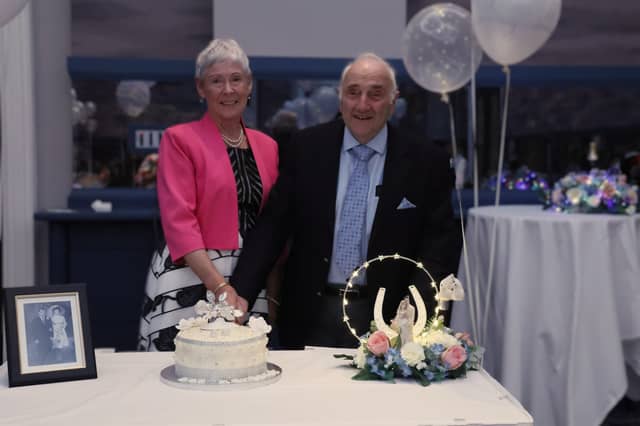 Margaret and Ken Gethings cut the cake to mark their anniversary