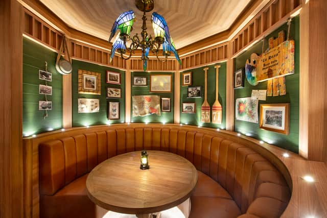 The lamp’s mouth points towards a life-size bronze statue of the love-struck thief and Princess Jasmine on a magical carpet ride. On the cruise’s final night, a Treasure Found farewell spirals lights embedded in balustrades and balconies upwards from the lamp to the ceiling.