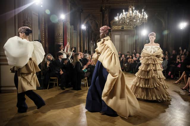 Viktor &amp; Rolf produced opulent frills and ruffles through a somewhat bleak and minimal palette of beige, white and blue.