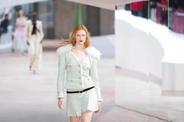 Chanel highlighted this revival in their spring/summer show through heavy shoulder pads, pussy bow blouses and vivid hues of fuchsia, violet and lime.