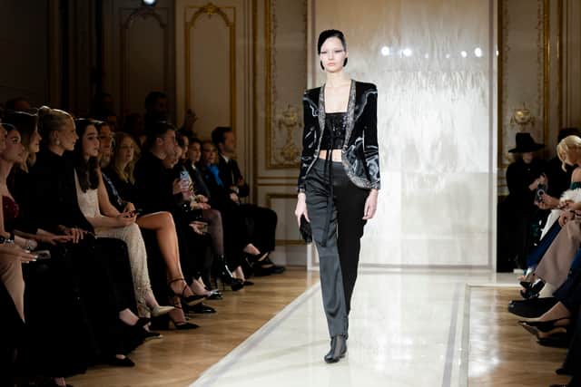 Armani’s pure and minimalist style is a deviation from Paris’s usual opulent couture, but his slinky cuts and unembellished designs brought a seductive coquettishness that was warmly received.
