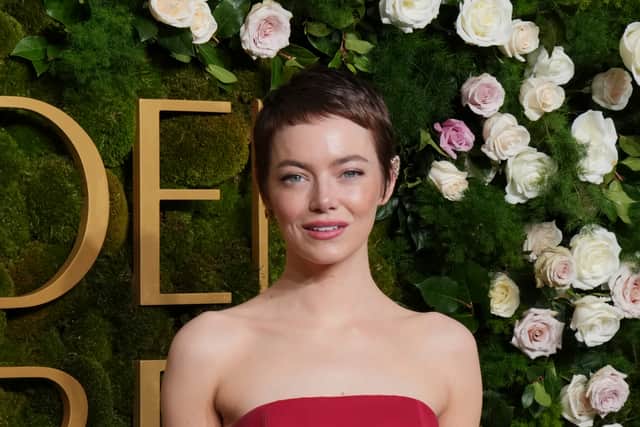 Stone swapped her auburn locks for a chocolate brown crop, styling her new look with wispy micro-bangs.