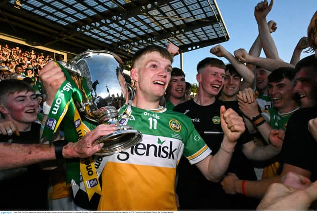 Every picture tells a tale as Offaly captain Dan Bourke holds onto the James Nowlan Cup.