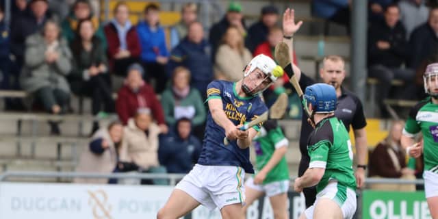 Odhran Fletcher (K/K) shoots as Andrew McEvoy (F/B) tackles. Picture: Aoife Maher.