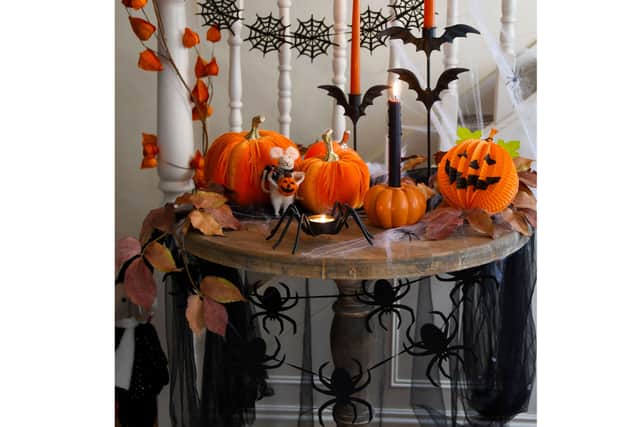 4. Garland – Orange Physalis, £24, Resin Candle Holder – Pumpkin, £4.99, Box of 4 Taper Candles – Black, £8.99, rest of items from a selection, Gisela Graham