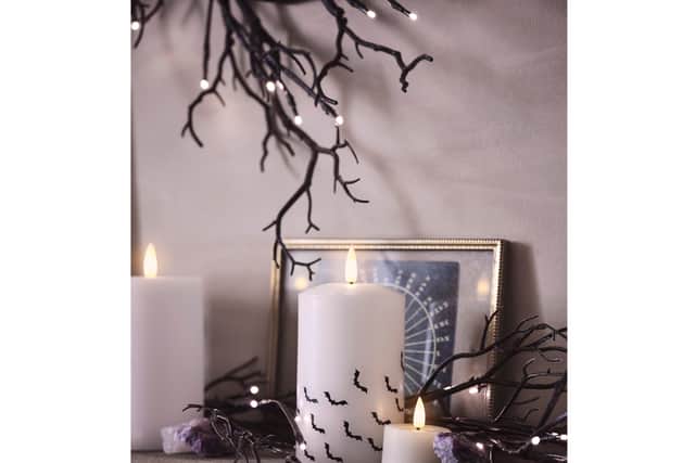 6. TruGlow Bat Decal LED Pillar Candle Trio, £29.99, 1.5m Pre-Lit Black Glitter Halloween Garland, £24.99, Lights4fun