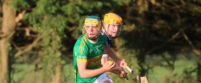 Daniel Hand gets away from Simon Og Lyons. Picture: Aoife Maher.