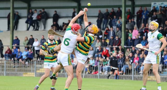Colin Egan (Belmont) and Jack Fogarty (Ballinamere) contest a high ball