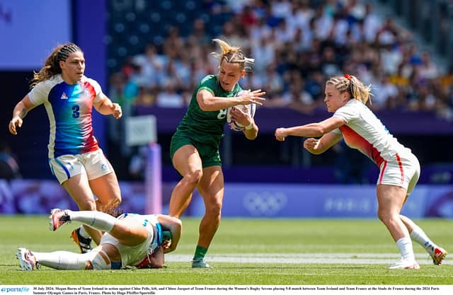 Megan Burns (centre) in action for Ireland Women's Sevens Rugby at the Stade de France against France in the play-off for fifth place at the Paris Olympics