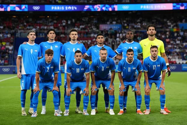 Israel’s national anthem was booed by some sections in the approximately half-full stadium prior to kick-off, and a group of spectators stood in a line wearing t-shirts with initials that spelled ‘Free Palestine’ in protest over the war in Gaza.
