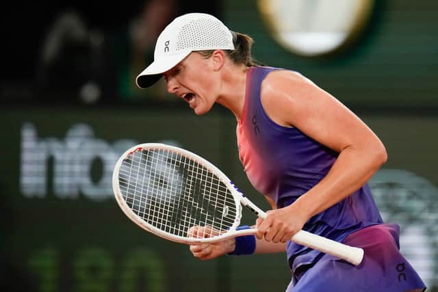 Defending champion Iga Swiatek celebrated her 23rd birthday by easing past Marie Bouzkova 6-4 6-2.