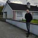 Sean Maher in front of a house in Presentation Place which has been idle for over a year .