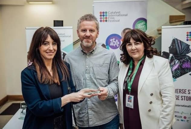 Maura Foley receiving her award during the Catalyst Film Festival. L. to r. Maura Foley, Paul C Ryan, Film in Limerick, and Dr Susan Liddy, Catalyst.