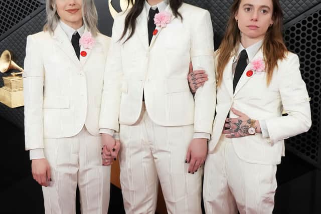 While American indie supergroup Boygenius turned heads on the red carpet in matching white suits.