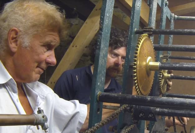 Horologist Nigel Barnes (on the left) and Gerry Murphy of Shinrone Heritage Group examining the turret clock in St Mary's Church of Ireland Shinrone.