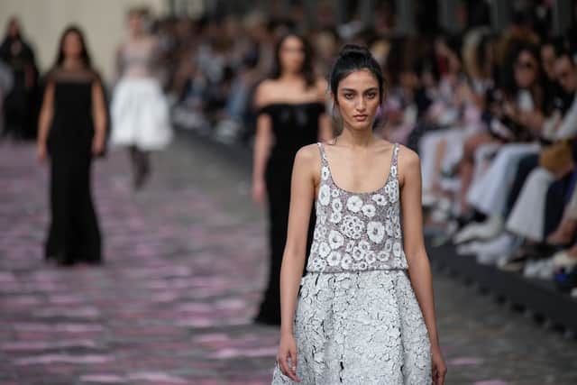Echoing the bouquet baskets, florals appeared throughout, with petals appliqued on blouses and embroidered on evening gowns.