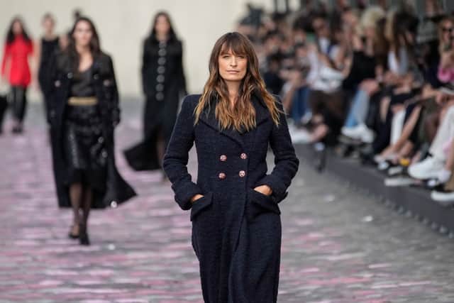 Model and long-time Chanel ambassador Caroline de Maigret walked in the show, the 48-year-old wearing a classic navy double-breasted coat.