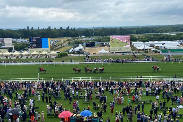 The first-named proved correct as the Queen favoured an ivory shade, with the procession receiving its habitual warm reception at the paddock.
