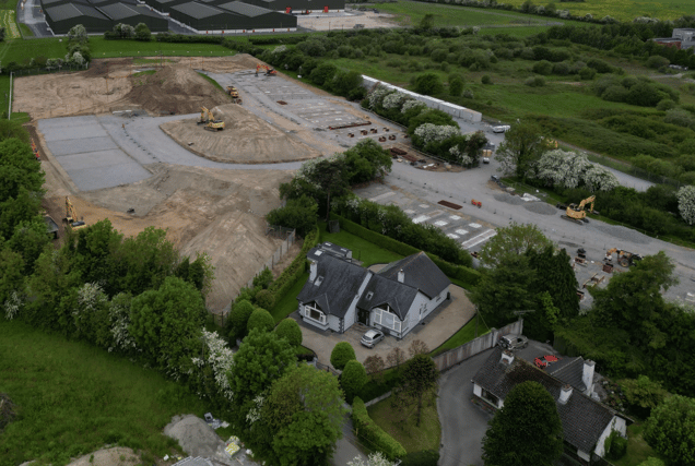 Drone footage shows the modular homes site beside and behind the houses on Clonminch Lane