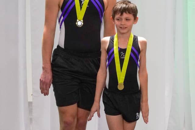 “They couldn't find a partner for him,” said Agnieszka. “He was waiting a year. They paired him with boys but they couldn't find one strong enough... and then last year [Simon and Konrad, right, pictured below with their medals] started together. Simon is 14 and is really tall and strong and together they're doing very well.”