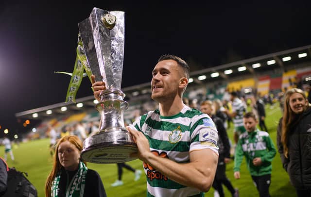 Aaron Greene, Shamrocks Rovers, celebrates with the League of Ireland trophy at the end of last season (Picture, Sportsfile)