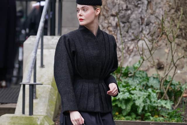 Actress Elle Fanning was also spotted heading into the service in an all-black ensemble with a matching pillar-box hat.