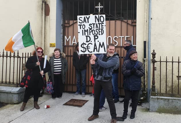 John McGhee, National Party (holding a sign), pictured three years ago protesting against direct provision in Tullamore