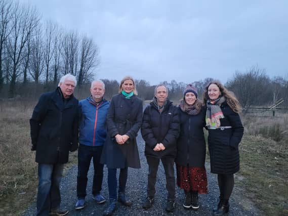 Minister Pippa Hackett with Cllr Eamon Dooley and members of Ferbane Tidy Towns, close to the start of the new boardwalk